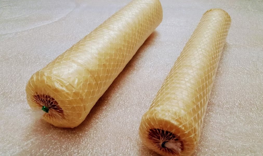 Dry salami collagen casing, netted rolls