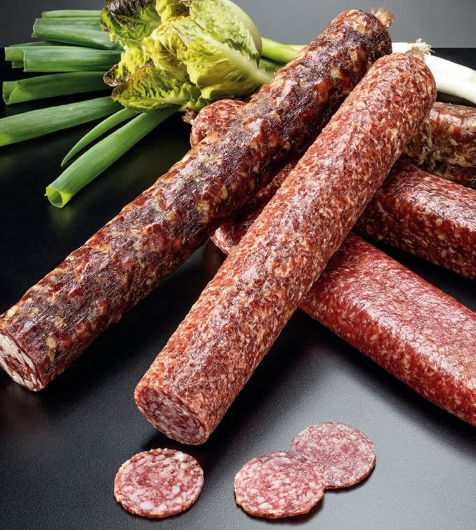Fibrous casing salami sliced, served with bread and tomatoes