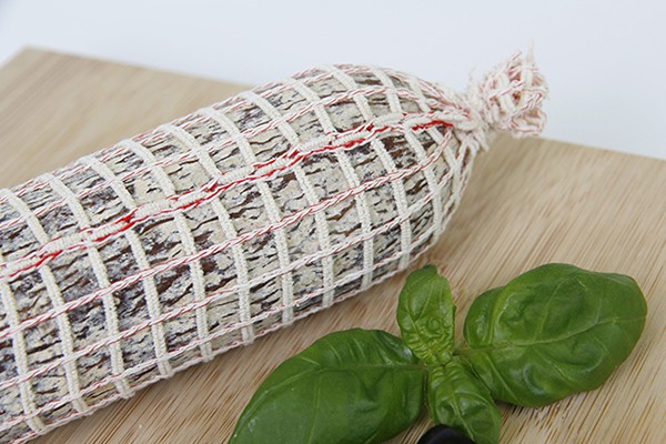 Large netting on cured salami