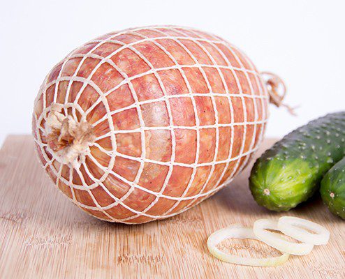 Standard netting on cooked ham roast
