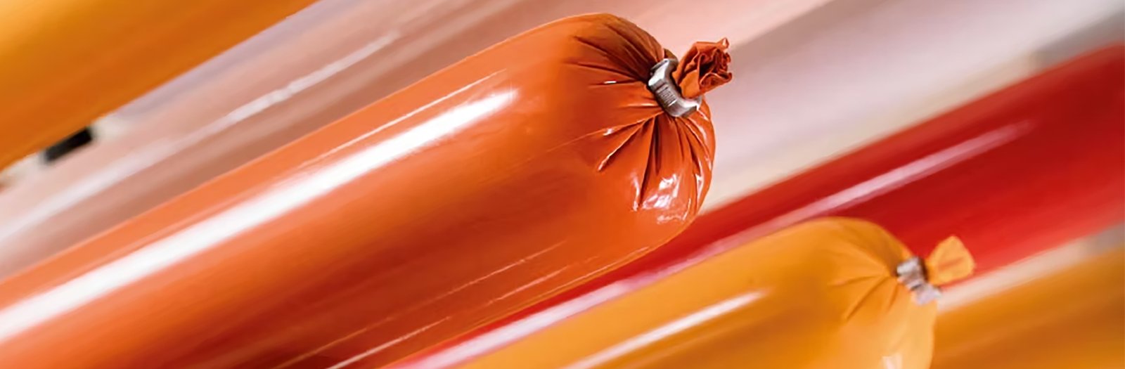 Colorful plastic sausage casings with metal clips