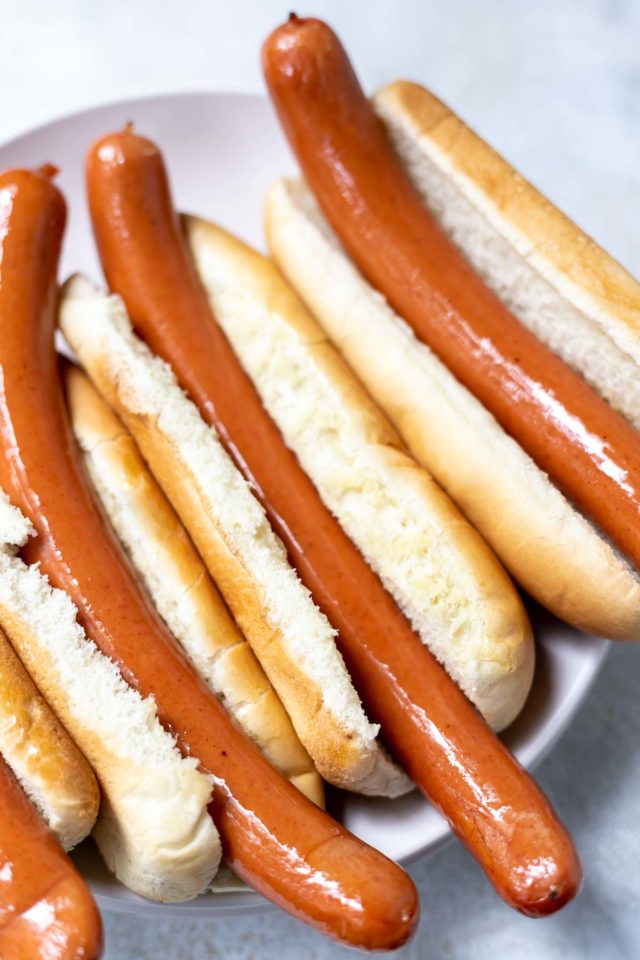 Hot dogs in natural sheep casings served in buns