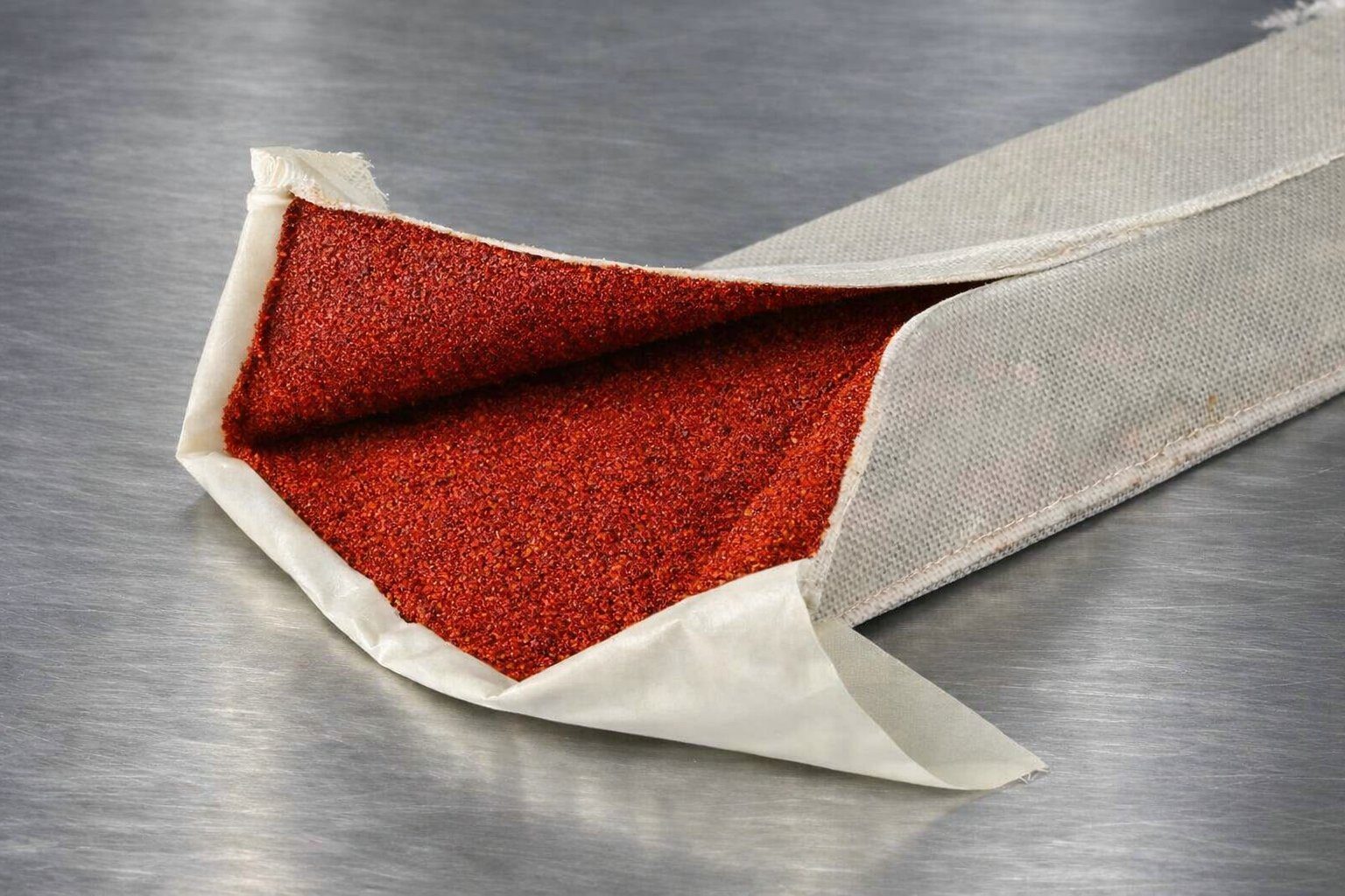 Diablo spice coated casing, vibrant red chili and paprika coating